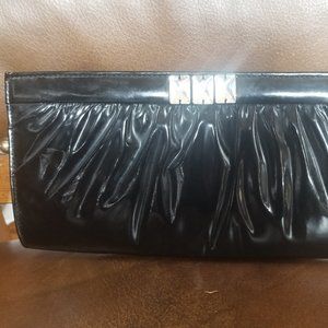 Patent leather clutch.